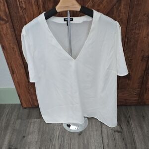 Express White Short Sleeve Blouse. Has A Few Black Spots On Bottom